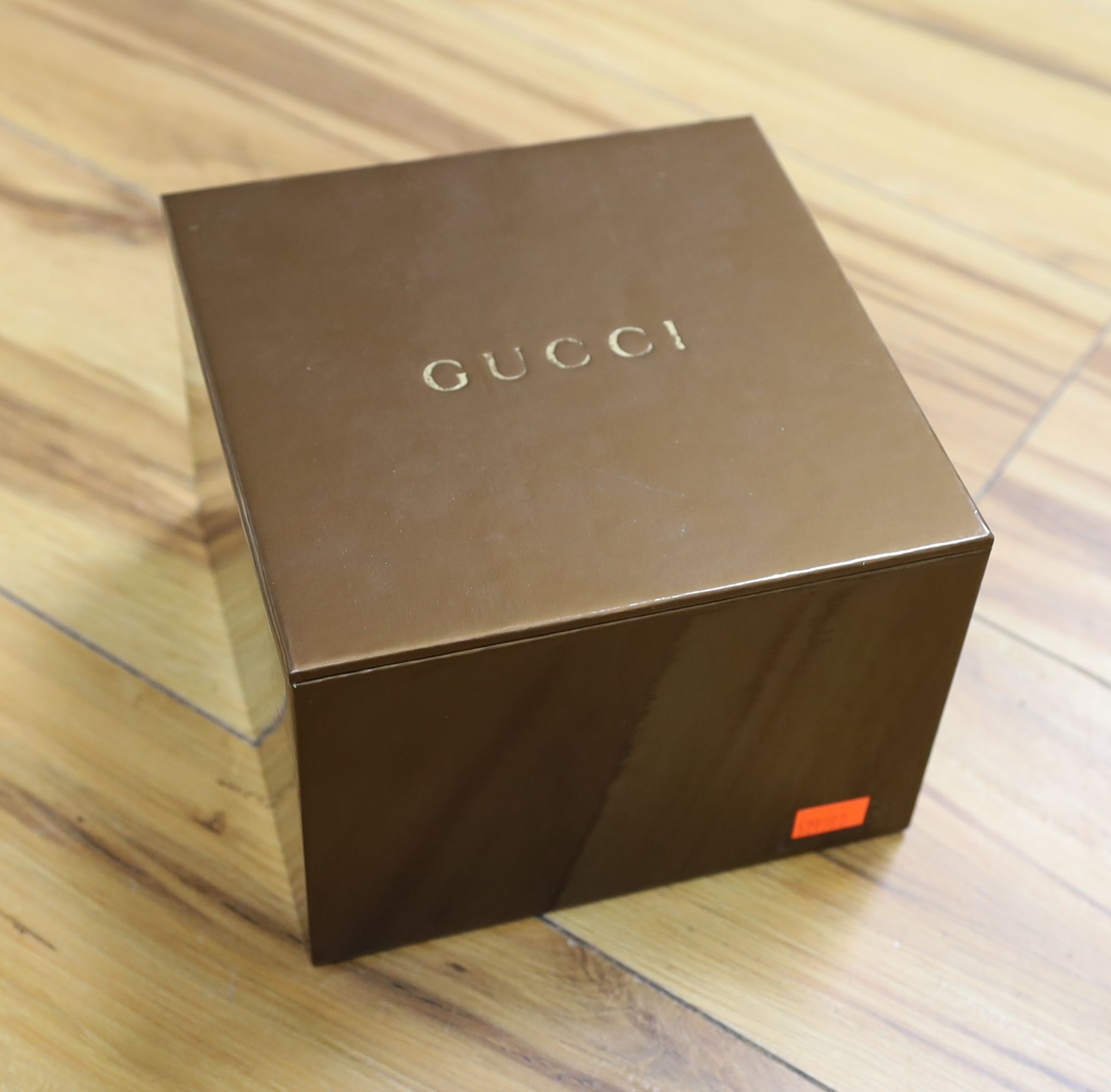 Two lady's modern steel Gucci quartz wrist watches, including one with mother of pearl dial with box.